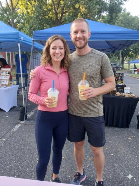 Guests holding Legendary Lemonades at an outdoor event