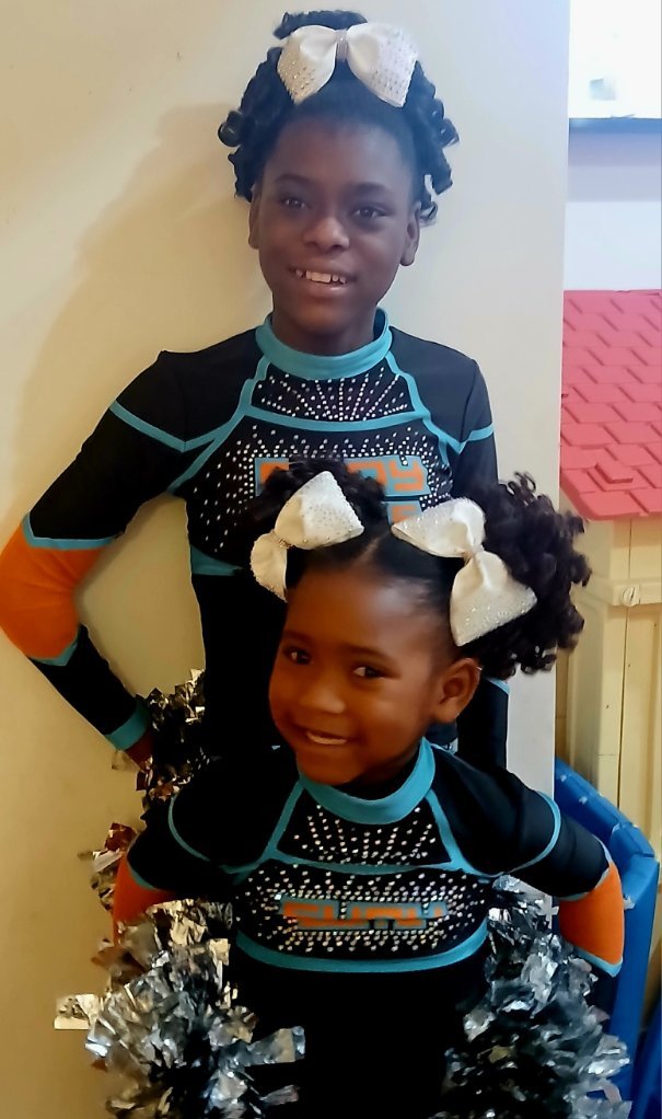 Legend and Grace in cheer uniforms